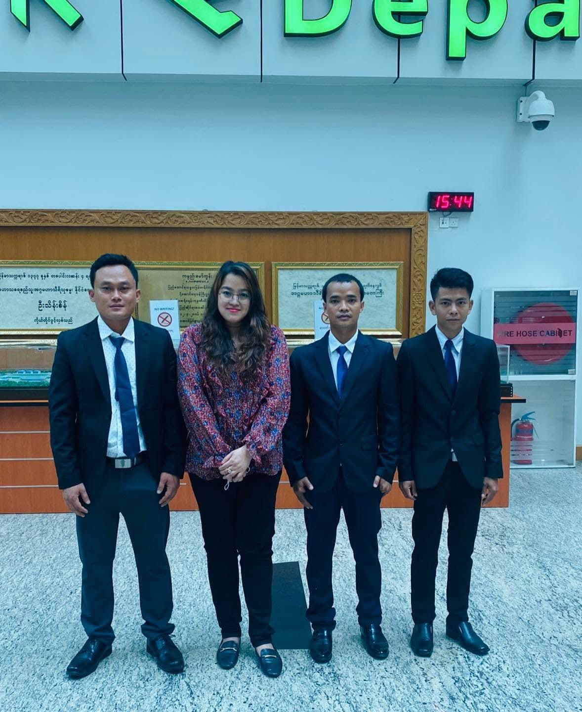 Group of four people at the airport departure area
